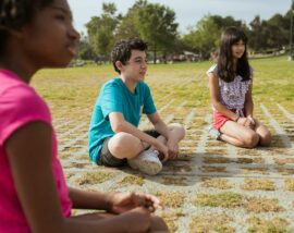 Children sat in field
