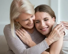 Mother and daughter hugging