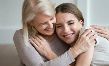 Mother and daughter hugging