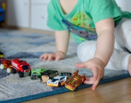 Child lining up cars