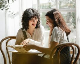 Two friends laughing