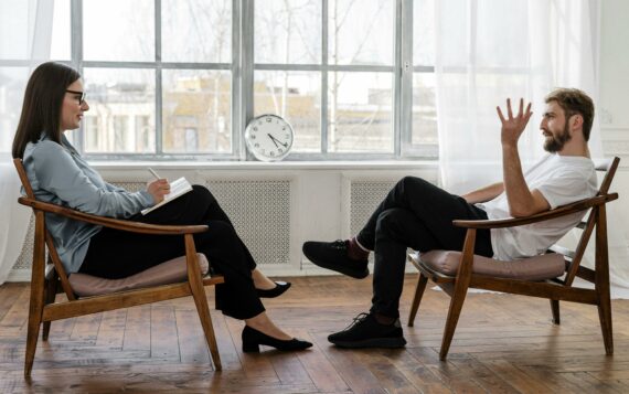Man and woman talking in appointment